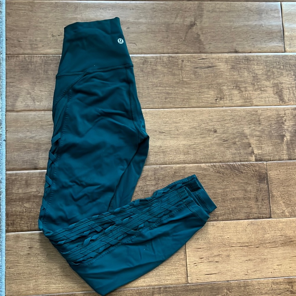 Lululemon green leggings with cross sheer stitch down the side